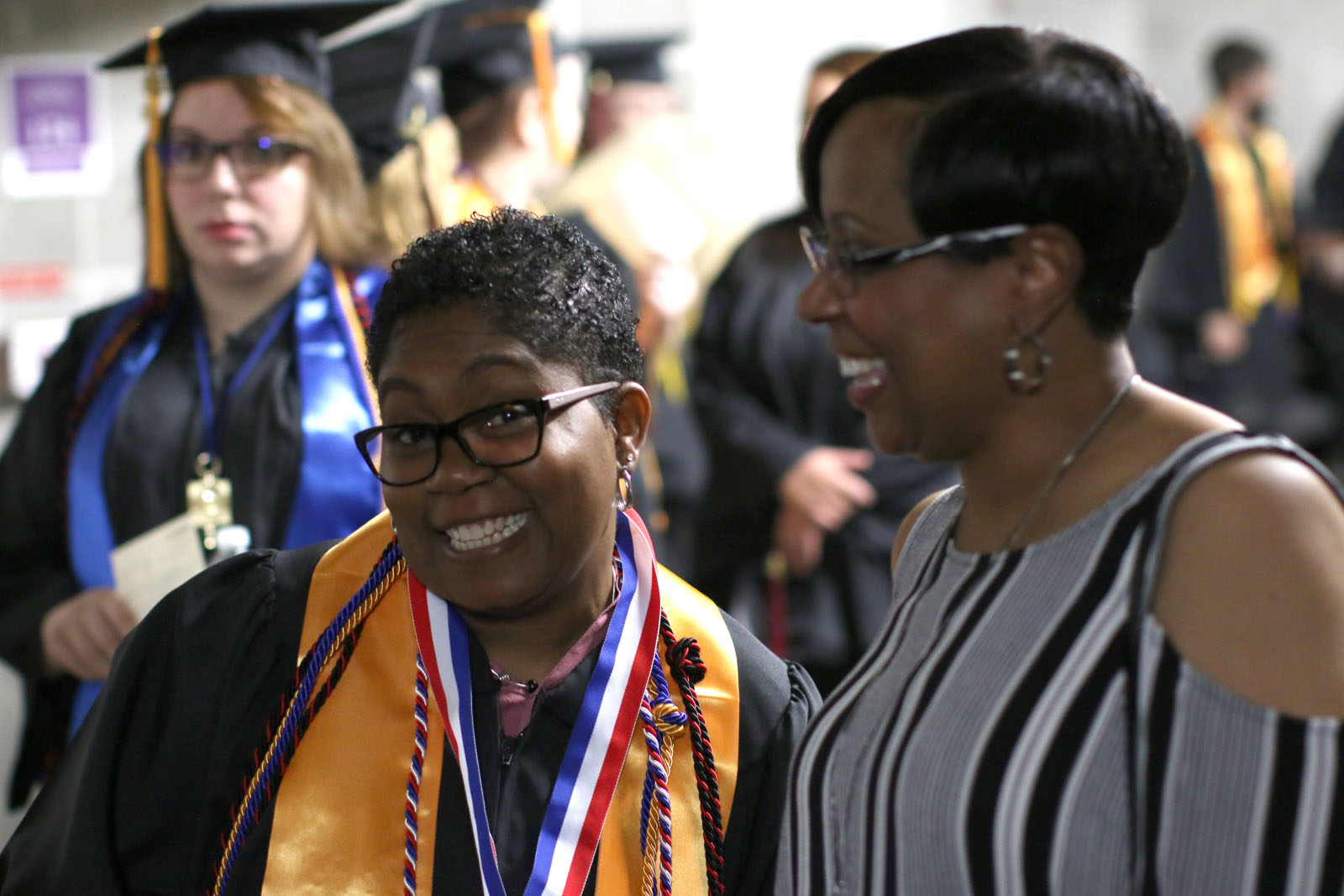 PPSC graduate with family at commencement ceremony