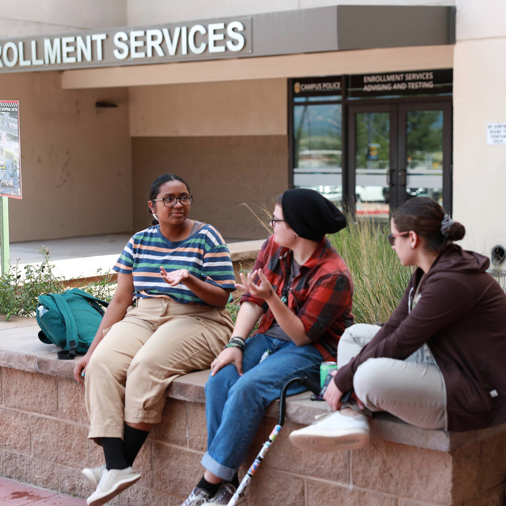 students sitting together outside