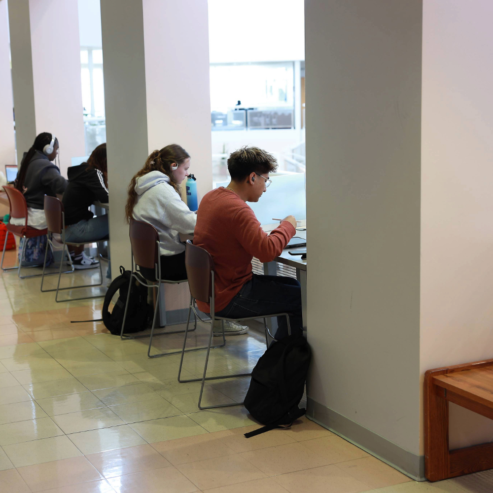 Students studying in rampart hallway