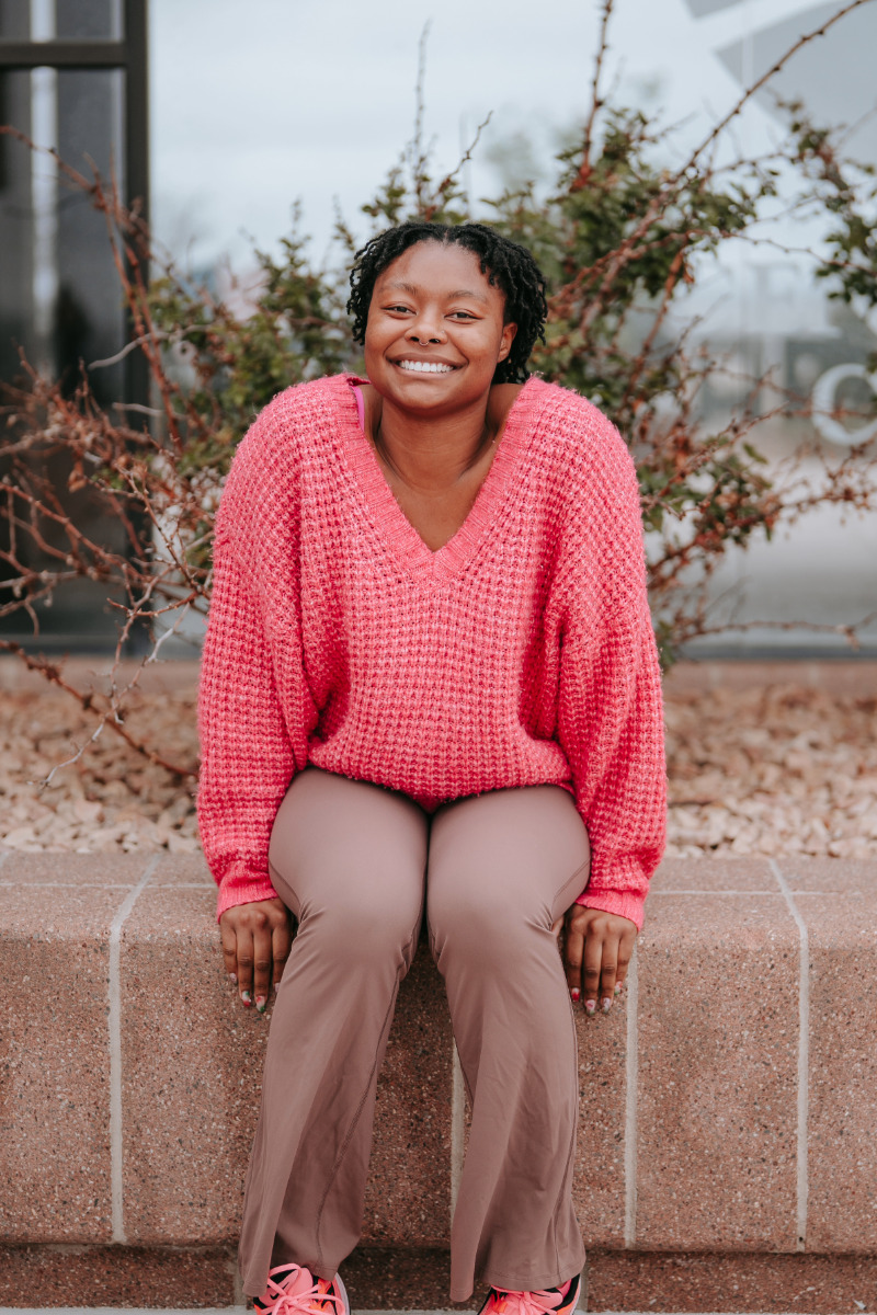 Student Smiling in Courtyard