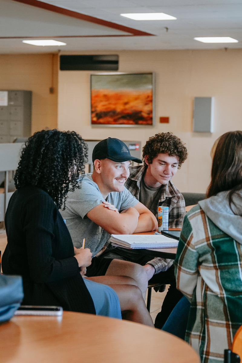 students sitting together at table