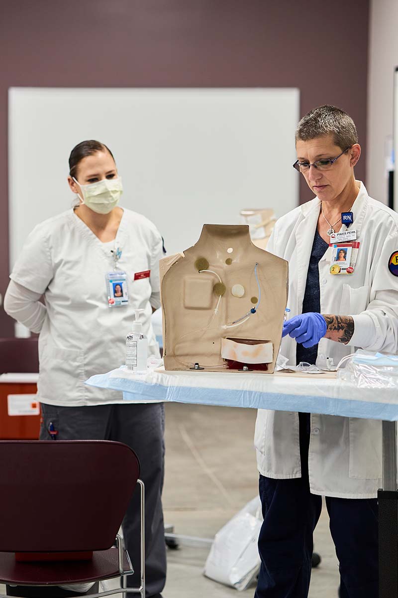 Instructor working with patient