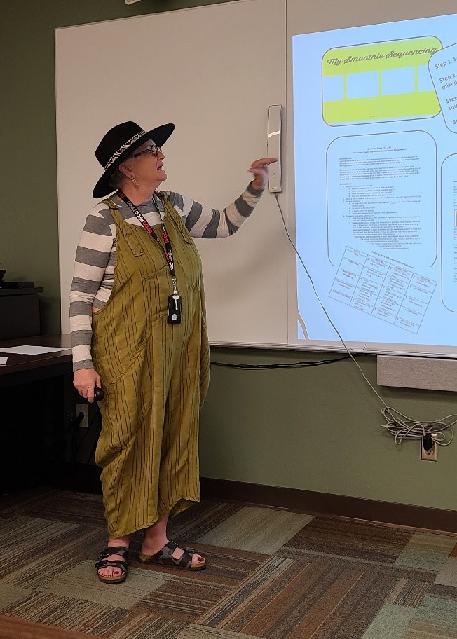 instructor teaching with presentation on a whiteboard 